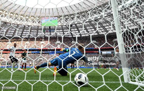 Hirving Lozano of Mexico scores his team's first goal past Manuel Neuer of Germany during the 2018 FIFA World Cup Russia group F match between...