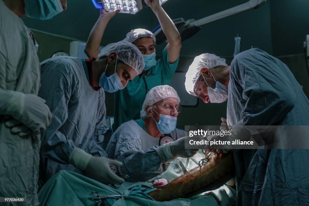 British vascular surgeon John Wolfe performs a surgery in Gaza