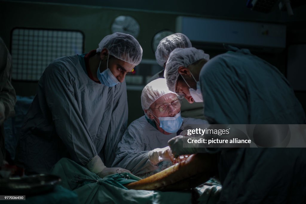 British vascular surgeon John Wolfe performs a surgery in Gaza