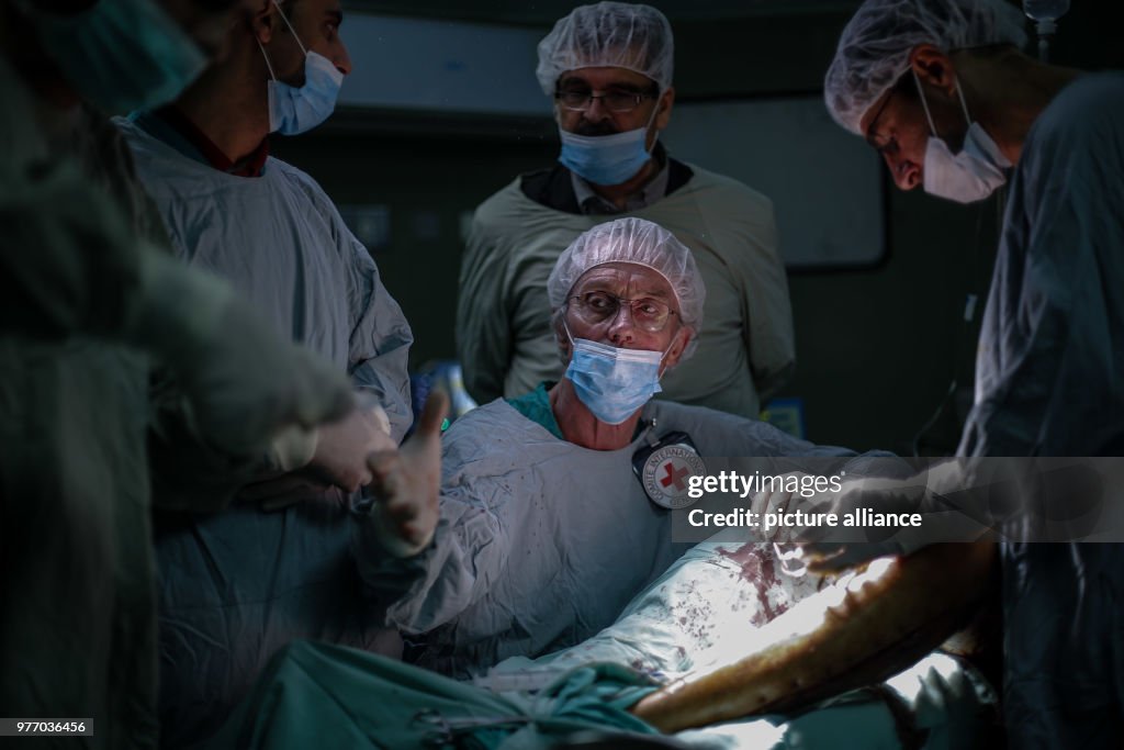 British vascular surgeon John Wolfe performs a surgery in Gaza
