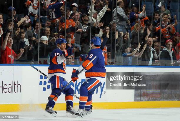 Richard Park of the New York Islanders celebrates his goal against the Toronto Maple Leafs with teammate Bruno Gervais on March 14, 2010 at Nassau...