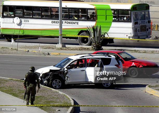 Mexican soldier patrols the scene where three US' Consulate staffers were killed in Ciudad Juarez, Mexico, on March 13, 2010. Ciudad Juarez, with 1.3...