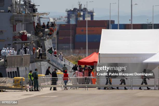 Migrants disembark from the Italian navy vessel Orione at the Port of Valencia on June 17, 2018 in Valencia, Spain. The Aquarius rescue ship is...