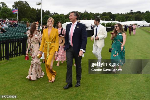 Lily Collins, Martha Hunt and Laurent Feniou attend the Cartier Queen's Cup Polo at Guards Polo Club on June 17, 2018 in Egham, England.