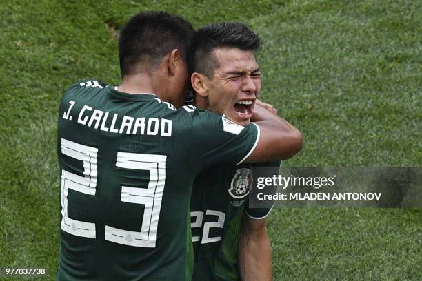 Mexico's forward Hirving Lozano is congratulated by Mexico's defender Jesus Gallardo after scoring during the Russia 2018 World Cup Group F football...