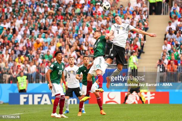 Julian Draxler of Germany competes with Hector Moreno of Mexico during the 2018 FIFA World Cup Russia group F match between Germany and Mexico at...