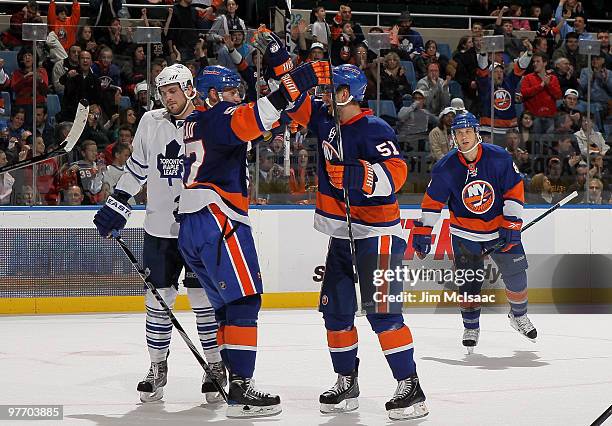 Frans Nielsen of the New York Islanders celebrates his second period goal against the Toronto Maple Leafs with teammate Blake Comeau on March 14,...