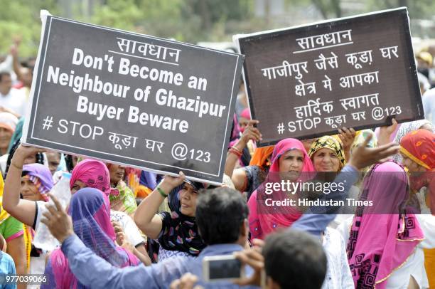 Residents and villagers during a protest march against dumping ground at Sector 123, on June 17, 2018 in Noida, India. The National Green Tribunal...