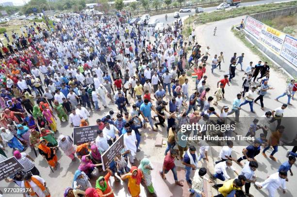 Residents and villagers during a protest march against dumping ground at Sector 123, on June 17, 2018 in Noida, India. The National Green Tribunal...