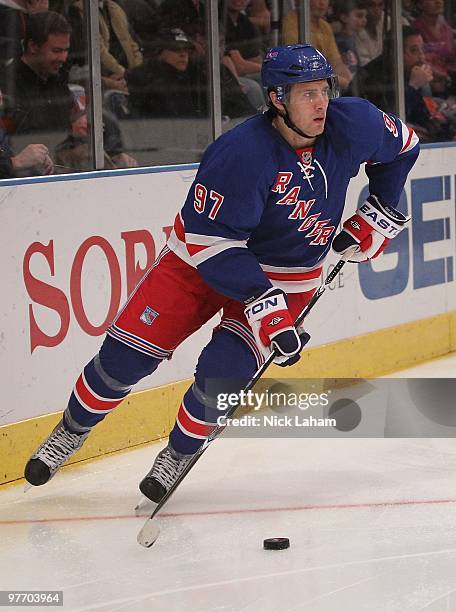 Matt Gilroy of the New York Rangers skates with the puck against the Philadelphia Flyers at Madison Square Garden on March 14, 2010 in New York City.