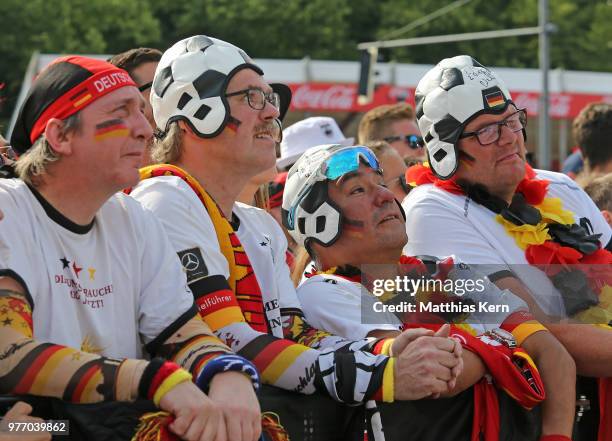 Fans of Germany watch the 2018 FIFA World Cup match between Germany and Mexico at the Fanmeile public viewing at Brandenburg Gate on June 17, 2018 in...