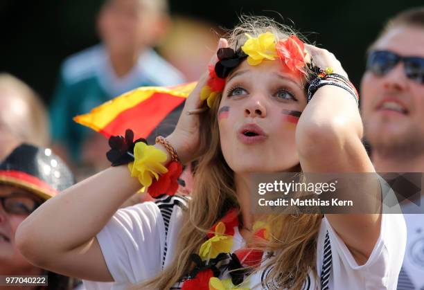 Fans of Germany watch the 2018 FIFA World Cup match between Germany and Mexico at the Fanmeile public viewing at Brandenburg Gate on June 17, 2018 in...