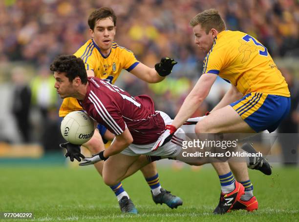 Roscommon , Ireland - 17 June 2018; Ian Burke of Galway in action against David Murray, left, and Peter Domican of Roscommon during the Connacht GAA...