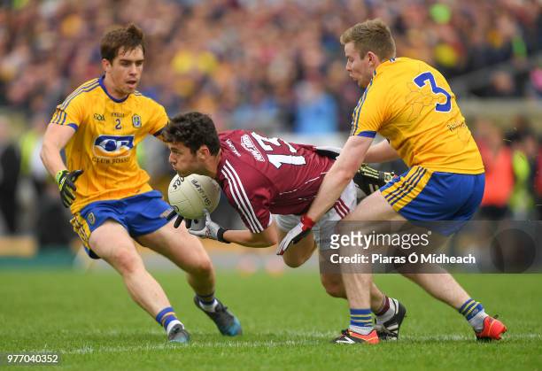 Roscommon , Ireland - 17 June 2018; Ian Burke of Galway in action against David Murray, left, and Peter Domican of Roscommon during the Connacht GAA...