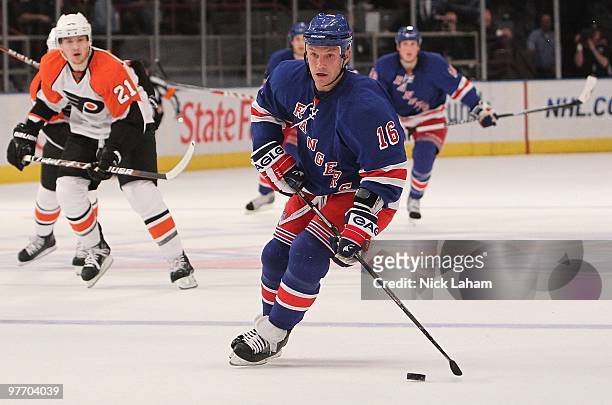 Sean Avery of the New York Rangers skates with the puck against the Philadelphia Flyers at Madison Square Garden on March 14, 2010 in New York City.
