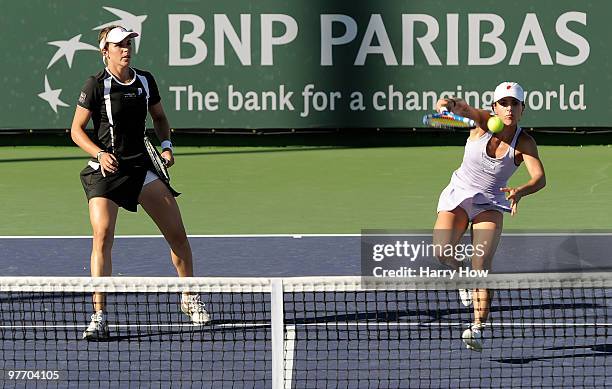 Nuria Llagostera Vives of Spain and Maria Jose Martinez Sanchez of Spain hit an overhead for a winner against Gisela Dulko of Argentina and Flavia...