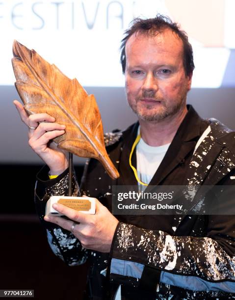 Timothy Morton accepts an award on behalf of Jeff Bridges at the 9th Annual New Media Film Festival at James Bridges Theater on June 16, 2018 in Los...