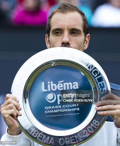 Richard Gasquet of France poses with his trophy after winning the men's final of the Libema Open tennis tournament in Rosmalen, The Netherlands, on...
