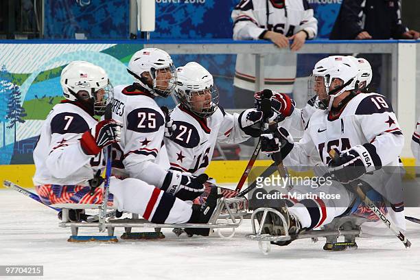 Alexi Salamone of the United States celebrates after scoring with teammates Taylor Lipsett, Bubba Torres and Taylor Chace during the second period of...