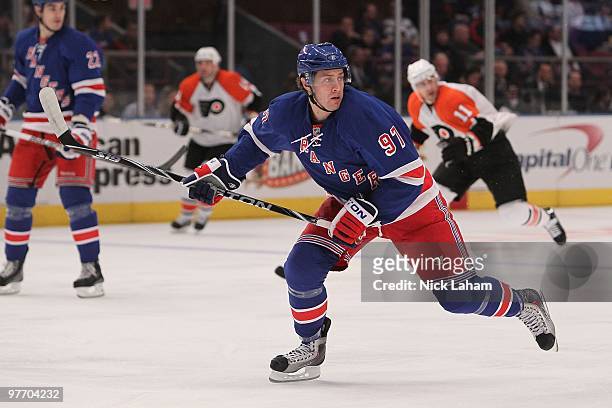 Matt Gilroy of the New York Rangers skates with the puck against the Philadelphia Flyers at Madison Square Garden on March 14, 2010 in New York City.