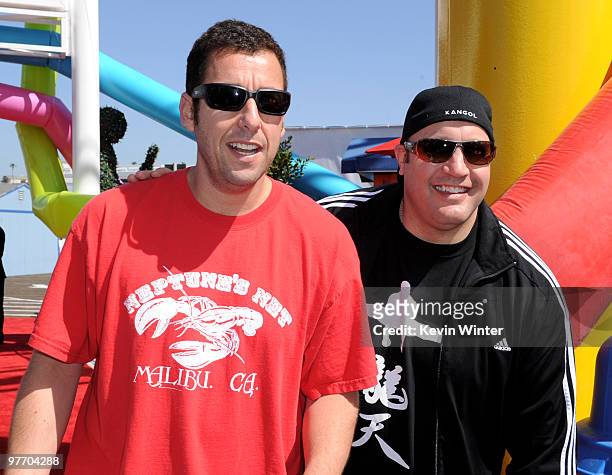 Actors Adam Sandler and Kevin James arrive at the Make-A-Wish Foundation event hosted by Kevin and Steffiana James at the Santa Monica Pier on March...