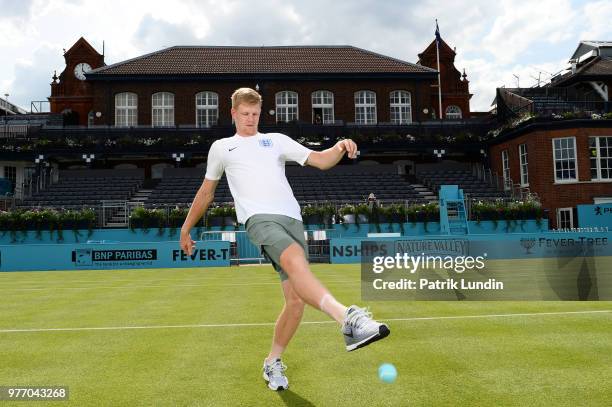 Kyle Edmund of Great Britain wearing an England shirt in support of the World Cup team during qualifying Day 2 of the Fever-Tree Championships at...