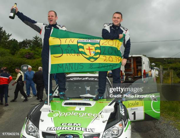 Letterkenny , Ireland - 17 June 2018; Manus Kelly and Donall Barrett in a Subaru Impreza WRC S12B celebrate at the end of stage 20 Glen after winning...