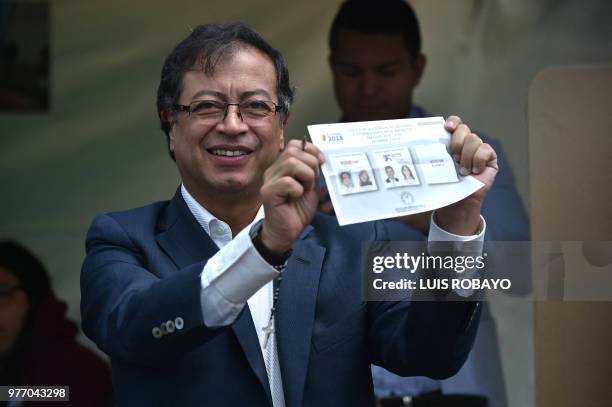 Presidential candidate Gustavo Petro shows his vote at a polling station during the second round of the presidential elections in Bogota, Colombia on...