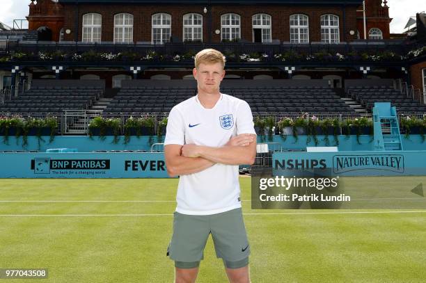 Kyle Edmund of Great Britain wearing an England shirt in support of the World Cup team during qualifying Day 2 of the Fever-Tree Championships at...