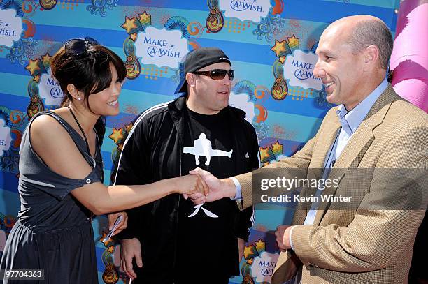 Actor Kevin James , his wife Steffiana and Make-A-Wish president and CEO David Williams arrive at the Make-A-Wish Foundation event hosted by Kevin...