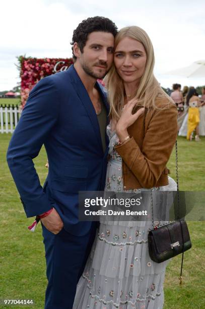 Joseph Bates and Jodie Kidd attend the Cartier Queen's Cup Polo Final at Guards Polo Club on June 17, 2018 in Egham, England.