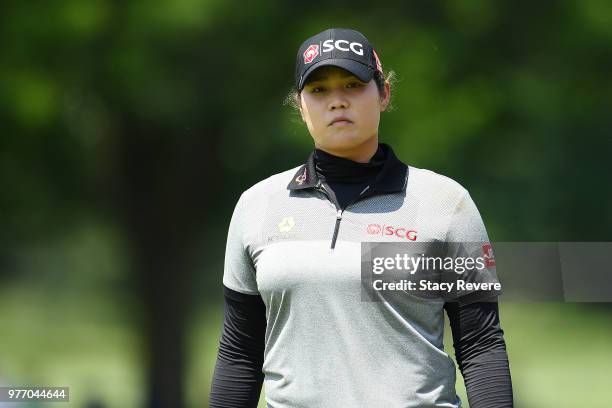 Ariya Jutanugarn of Thailand walks across the 18th green during the final round of the Meijer LPGA Classic for Simply Give at Blythefield Country...