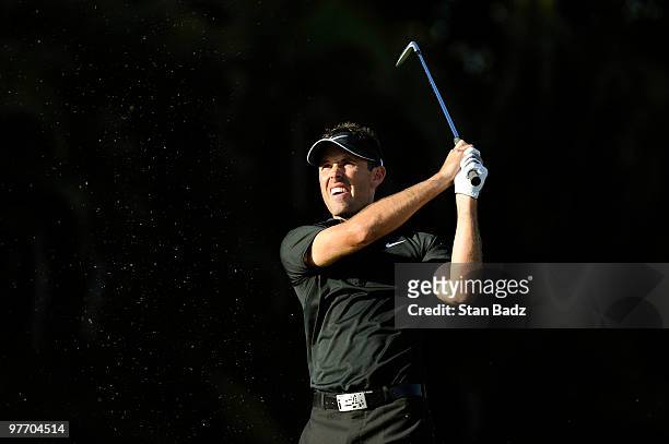 Charl Schwartzel of South Africa hits from the 15th tee box during the final round of the World Golf Championships-CA Championship at Doral Golf...
