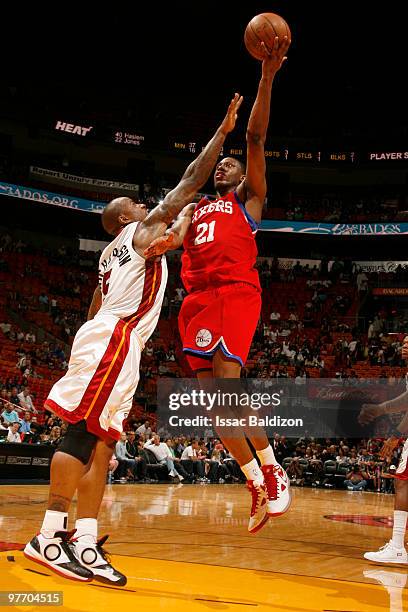 Thaddeus Young of the Philadelphia 76ers shoots against Quentin Richardson of the Miami Heat on March 14, 2010 at American Airlines Arena in Miami,...