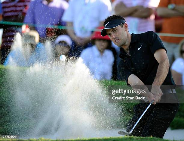 Charl Schwartzel of South Africa hits onto the 16th green during the final round of the World Golf Championships-CA Championship at Doral Golf Resort...