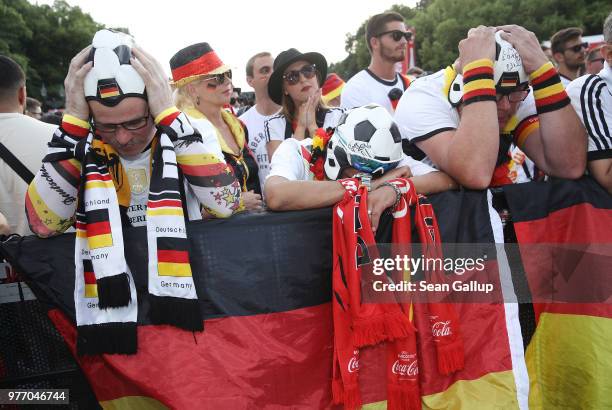 Germany fans react to play at the Fanmeile public viewing area during the Germany vs. Mexico 2018 FIFA World Cup match on June 17, 2018 in Berlin,...