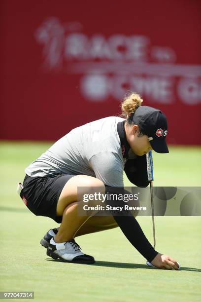 Ariya Jutanugarn of Thailand lines up a putt on the 18th green during the final round of the Meijer LPGA Classic for Simply Give at Blythefield...