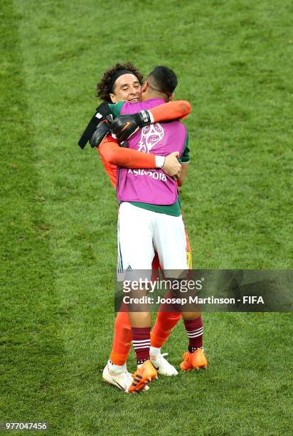 Guillermo Ochoa of Mexico celebrates with teammate Marco Fabian following his sides victory in the 2018 FIFA World Cup Russia group F match between...