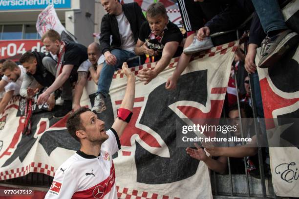 April 2018, Germany, Leverkusen: Soccer: Bundesliga, Bayer Leverkusen vs VfB Stuttgart, in the BayArena. Stuttgart's Dennis Aogo celebrating their...