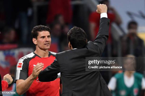 April 2018, Germany, Leverkusen: Soccer: Bundesliga, Bayer Leverkusen vs VfB Stuttgart, in the BayArena. Stuttgart's head coach Tyfun Korkut and...