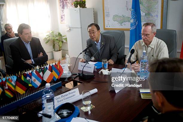 In this handout image provided by the United Nations Stabilization Mission in Haiti , UN Secretary General Ban Ki-moon and acting SRSG Edmond Mulet...