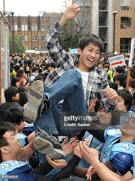 Student is tossed into the air after passing the entrance examination for Tokyo University on March 10, 2010 in Tokyo, Japan. Tokyo University is...