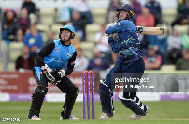 Alex Blake of Kent hits out watched by Ben Cox of Worcestershire Rapids during the Royal London One-Day Cup Semi-Final match between Worcestershire...