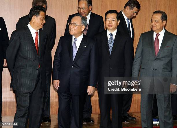 Fujio Mitarai, chairman of the Japan Business Federation, known as Keidanren, second from left, speaks with Wang Zhongyu, president of China...