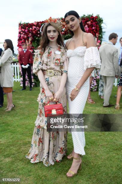 Lily Collins and Neelam Gill attend the Cartier Queen's Cup Polo Final at Guards Polo Club on June 17, 2018 in Egham, England.
