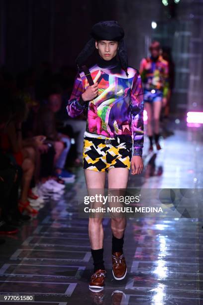 Model presents a creation by Prada during the men & women's spring/summer 2019 collection fashion show in Milan, on June 17, 2018.