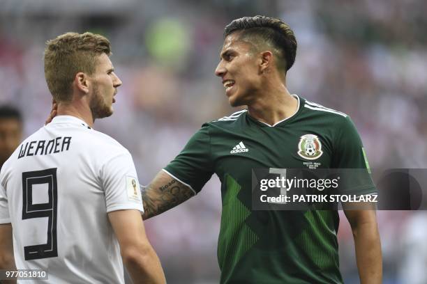 Mexico's defender Carlos Salcedo touches the neck of Germany's forward Timo Werner as he speaks to him during the Russia 2018 World Cup Group F...