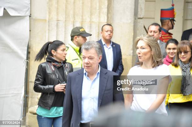 Colombian President Juan Manuel Santos arrives to vote in the company of his wife Maria Clemencia Rodriguez in the second round of the presidential...