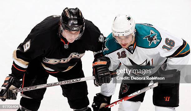 Devin Setoguchi of the San Jose Sharks battles for position during a face off against Bobby Ryan of the Anaheim Ducks during the game on March 14,...