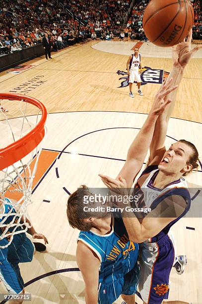 Louis Amundson of the Phoenix Suns puts a shot up over Aaron Gray of the New Orleans Hornets in an NBA Game played on March 14, 2010 at U.S. Airways...